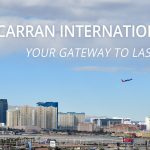 View of Las Vegas skyline with airplanes flying near the airport runway.