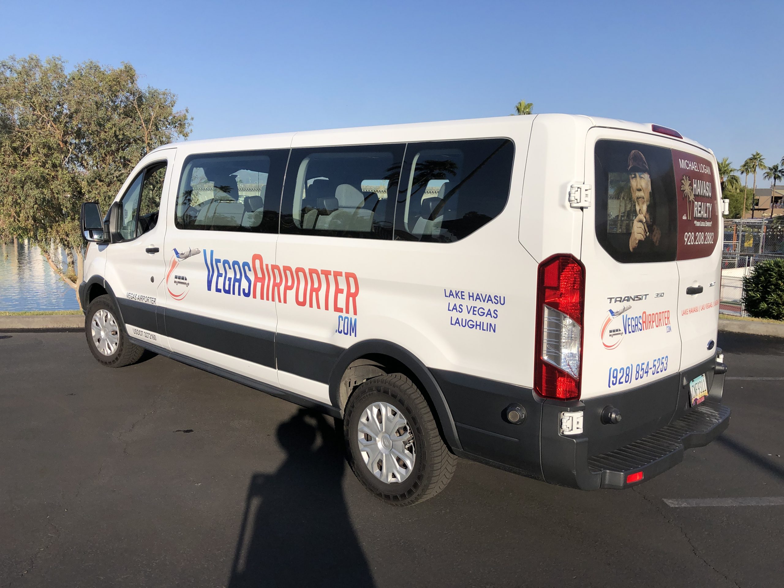 White van with 'Press Reporter' branding parked outdoors.